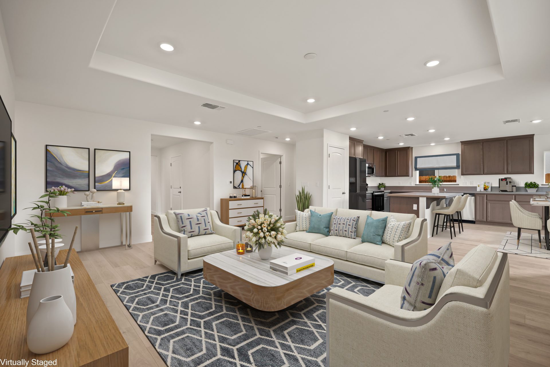 A virtually staged seating area with couch and two chairs, area rug and square coffee table. In the distance a kitchen and dining area virtually staged.